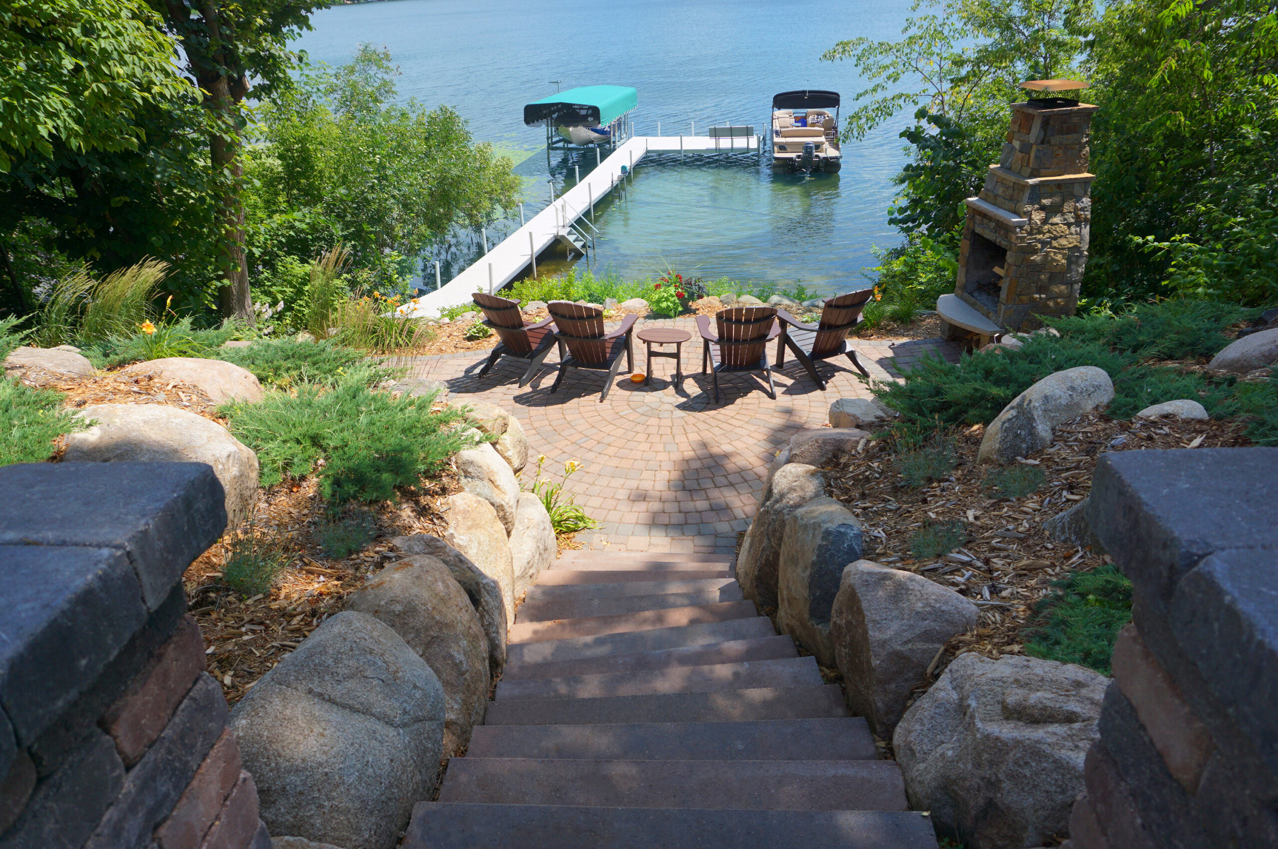 Lakefront custom landscape design with paver patio.